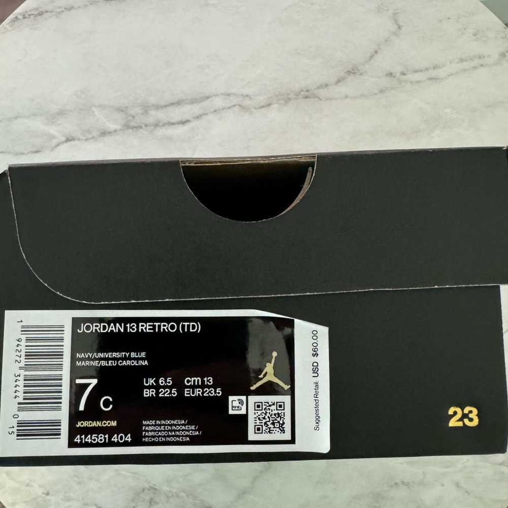 Brand new, never worn Jordan 13 Retro Navy/University Blue. Size 7C (toddler).